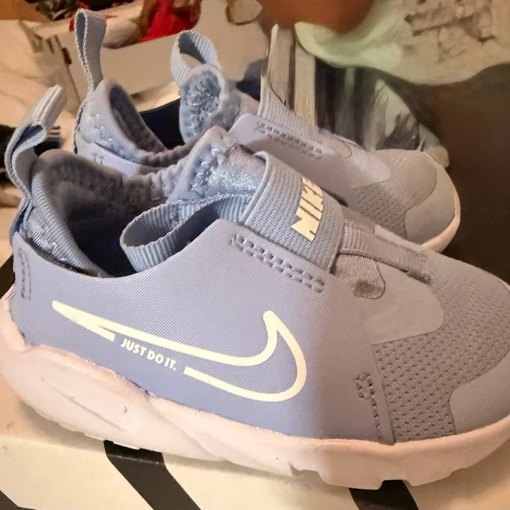 Nike Light Blue Slip-On Sneakers with White Swoosh
